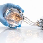 Glass sphere with a glowing neural network linked to an imaging device, illustrating high-risk AI systems in medical devices